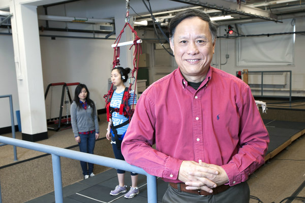 Clive Pai in front of walkway for training seniors not to fall. Photo / Roberta Dupuis-Devlin/UIC Photo Services 